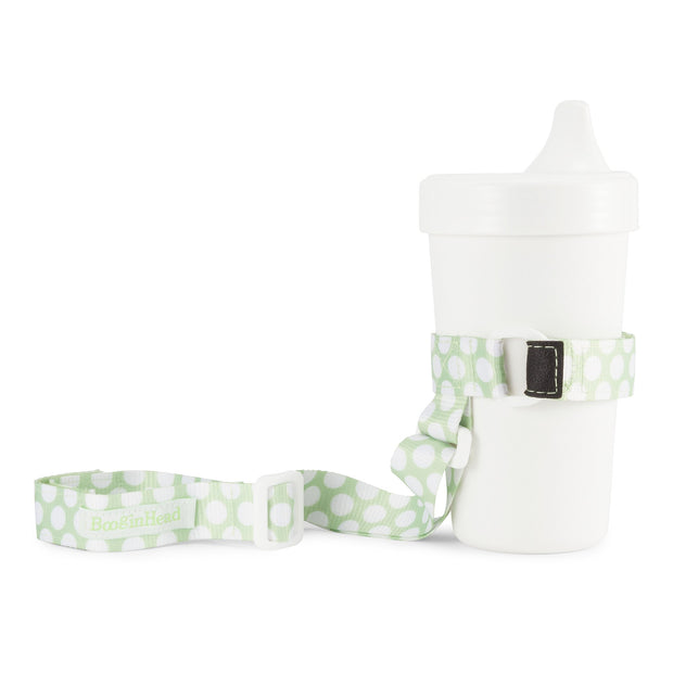 BooginHead SippiGrip in Delicate Dot Green with adjustable straps. Keep bottles and sippy cups clean and off the floor with the cup holders. Attaches toddler sippy cups, bottles or toys to a highchair or stroller. 