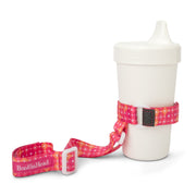 BooginHead SippiGrip in Dottie keeps sippy cup from falling on the ground getting dirty or lost. Keeps baby items off the ground and clean. Bright pink with orange and white polka dot design 