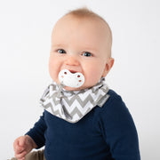 baby boy  wearing BoobinHead Bandana Teether Bib with pacifier loop holder and adjustable size snap closure
