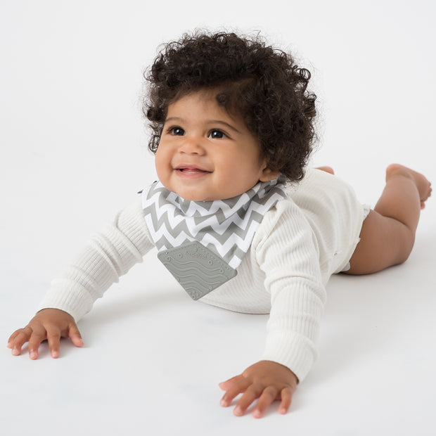 toddler  wearing BoobinHead Bandana Teether Bib in Gray Chevron with soft silicone gray teething piece