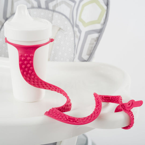 BooginHead SippiGrip Silicone in hot pink, strap to hold a sippy cup, bottle or toy, with soothing teething bumps.
