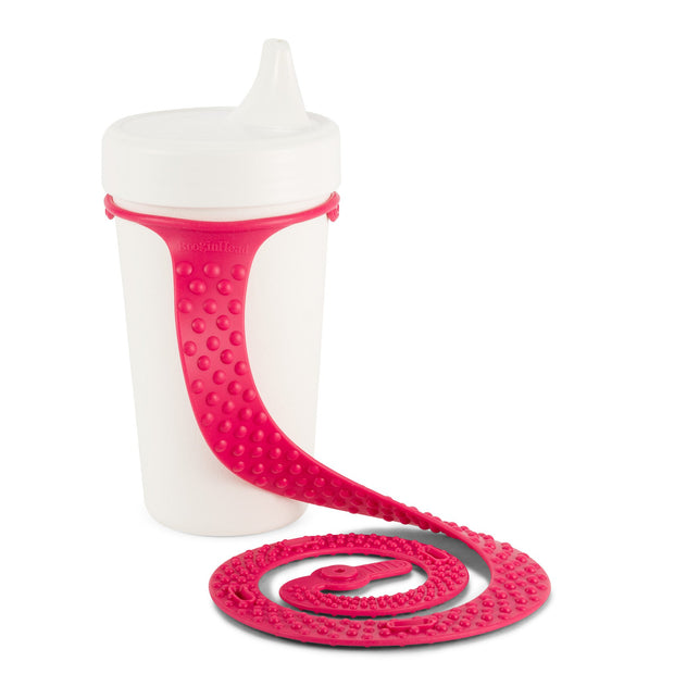 Booginhead SippiGrip Silicone in hot pink on a toddler sippy cup. Must have baby supply. Easy to clean, silicone cup holder strap, size adjusts for bottle or toys