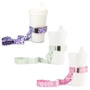 3 pack of BooginHead SippiGrips. Adjustable strap for baby and toddler items, from a woman owned small business. Purple Daisy has purple background with white flowers, Delicate Dot Green is white polka dots on a light green background, Pink Hearts has dark pink background with light pink hearts. 
