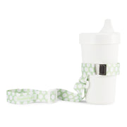 BooginHead SippiGrip in Delicate Dot Green with adjustable straps. Keep bottles and sippy cups clean and off the floor with the cup holders. Attaches toddler sippy cups, bottles or toys to a highchair or stroller. 