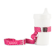 BooginHead SippiGrip in Pink Polka Dots with adjustable straps. Keep bottles and sippy cups clean and off the floor with the cup holders. Attaches toddler sippy cups, bottles or toys to a highchair or stroller. Bright hot pink background with white polka dots.