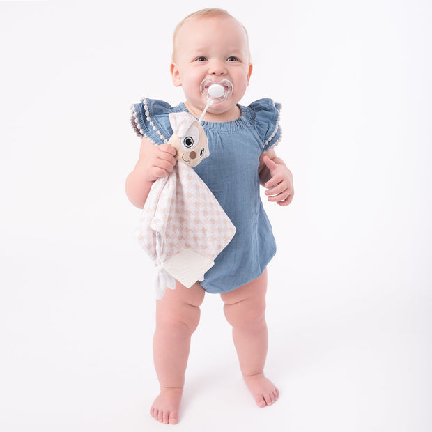 Toddler using the BooginHead Plush PaciPal Teether Blanket, Patches the Puppy. Keeps track of pacifier with attaching loop. Super soft fabric from a woman owned small business. Essential baby gear!