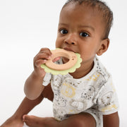 Baby using BooginHead silicone & wood teething rings, green lion
